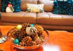 The color scheme of our living room is neutral with turquoise. So this is my table centerpeice for the living room with pinecones I made with ornaments.