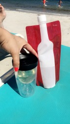 the best beach accessories around... wine bottle and glass! haha